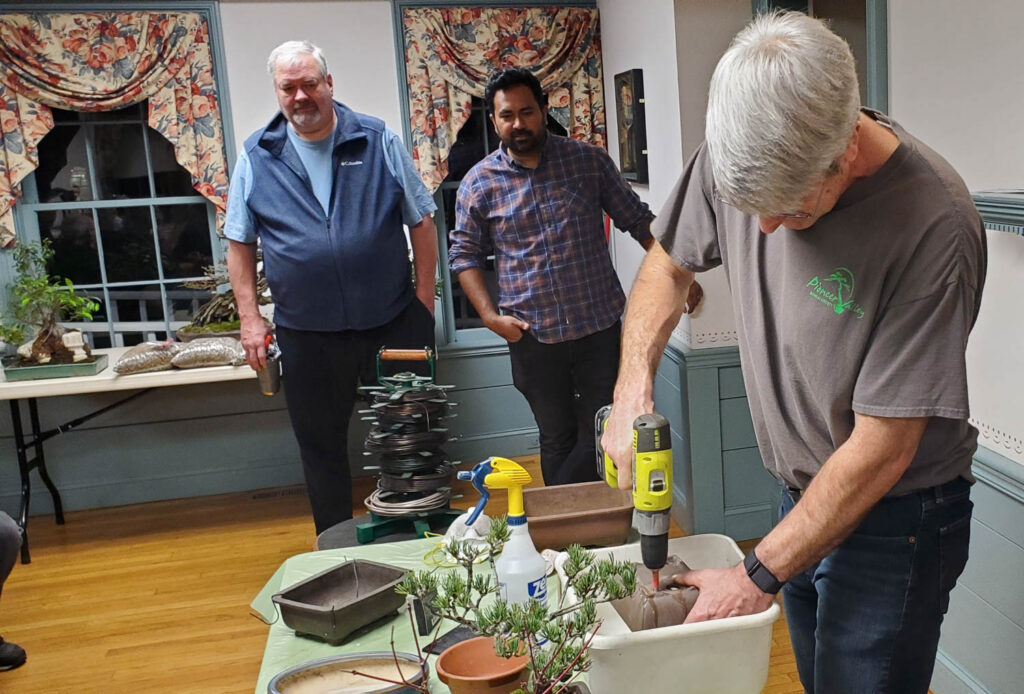 Doug drilling hole in pot